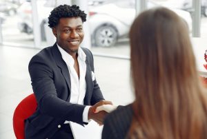 Real estate agent shaking hands with a client